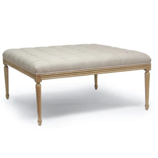 Pouf capitonné et rembourré avec pieds en bois sculpté