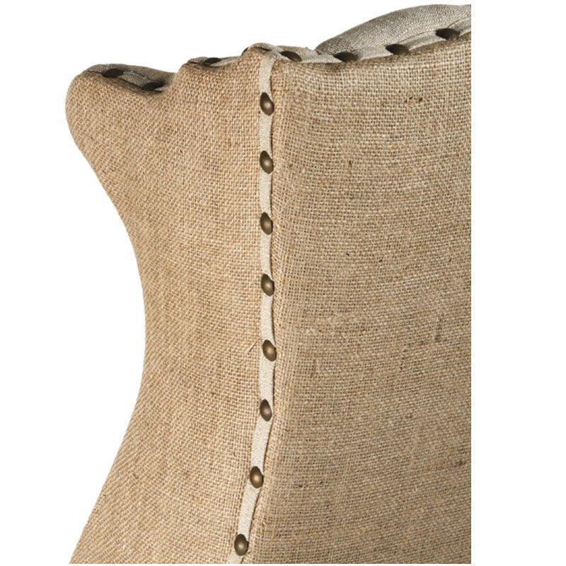 Fauteuil à oreilles capitonné en toile de jute et lin