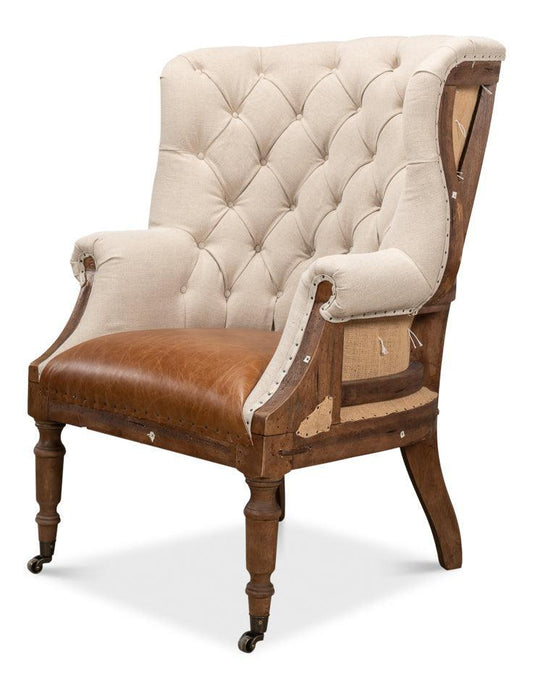 Fauteuil capitonné déconstruit avec assise en cuir