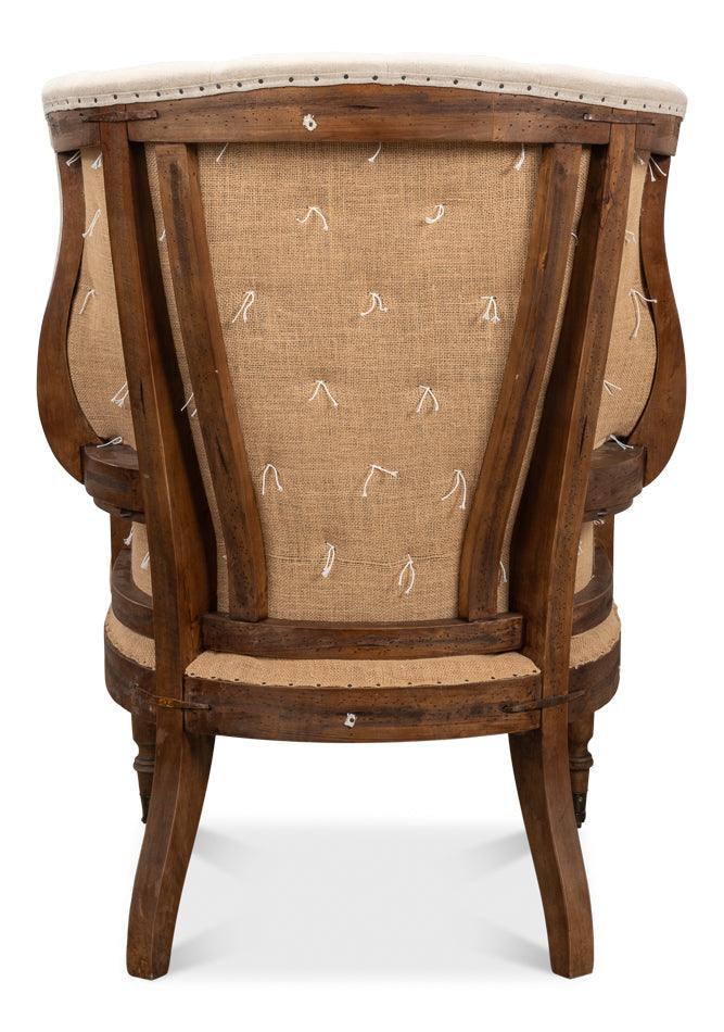 Fauteuil capitonné déconstruit avec assise en cuir