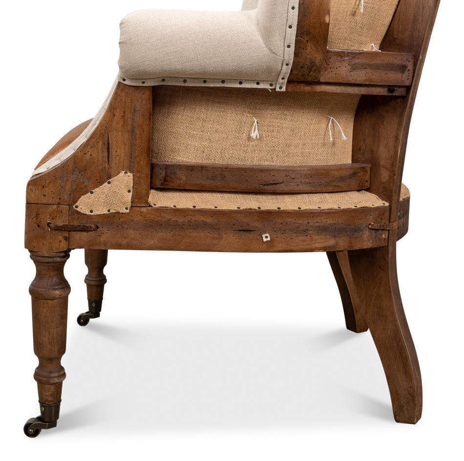 Fauteuil capitonné déconstruit avec assise en cuir