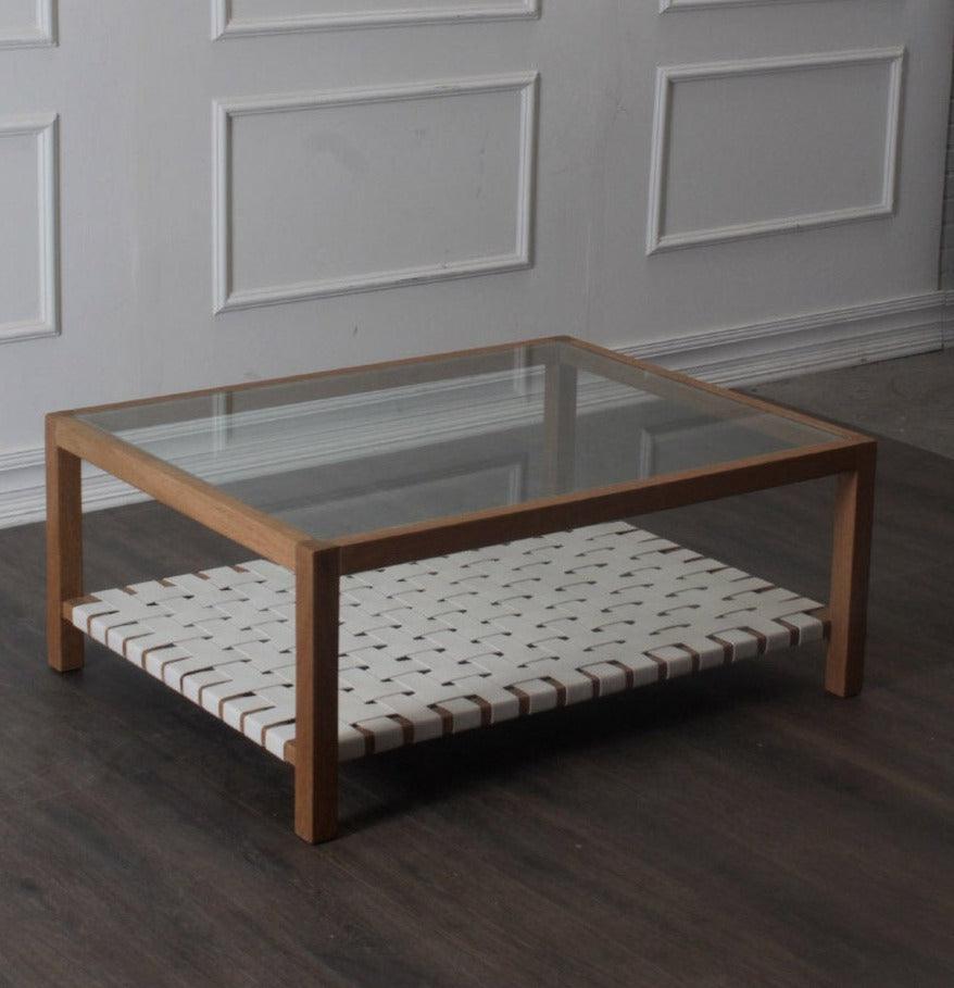 Table basse avec plateau en verre et sangles en cuir