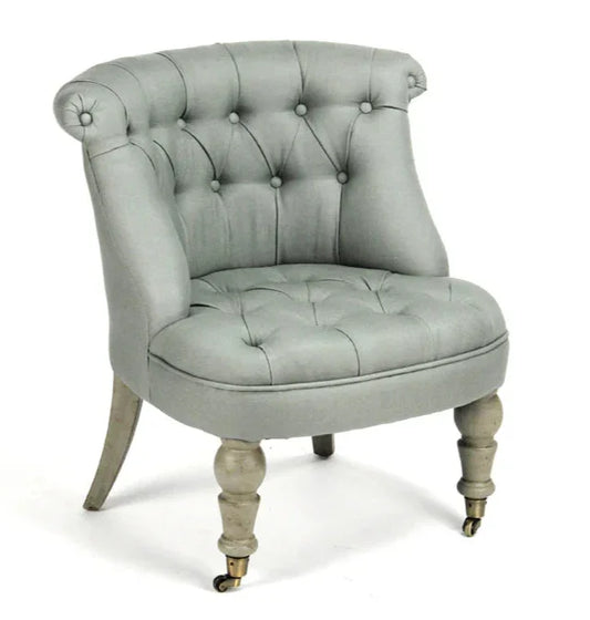 Fauteuil pantoufle capitonné bleu sauge