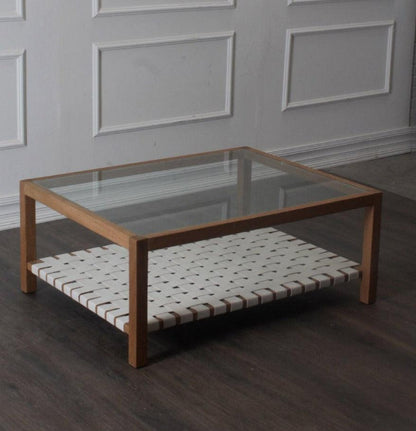 Table basse avec plateau en verre et sangles en cuir