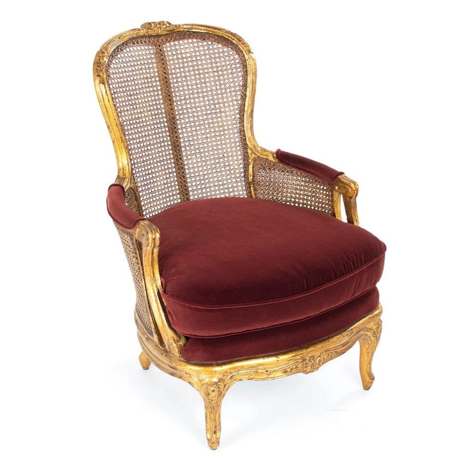 Fauteuil luxueux en rotin doré français avec coussin en velours rouge