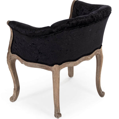 Fauteuil capitonné en velours noir