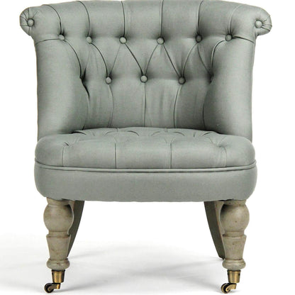 Fauteuil pantoufle capitonné bleu sauge